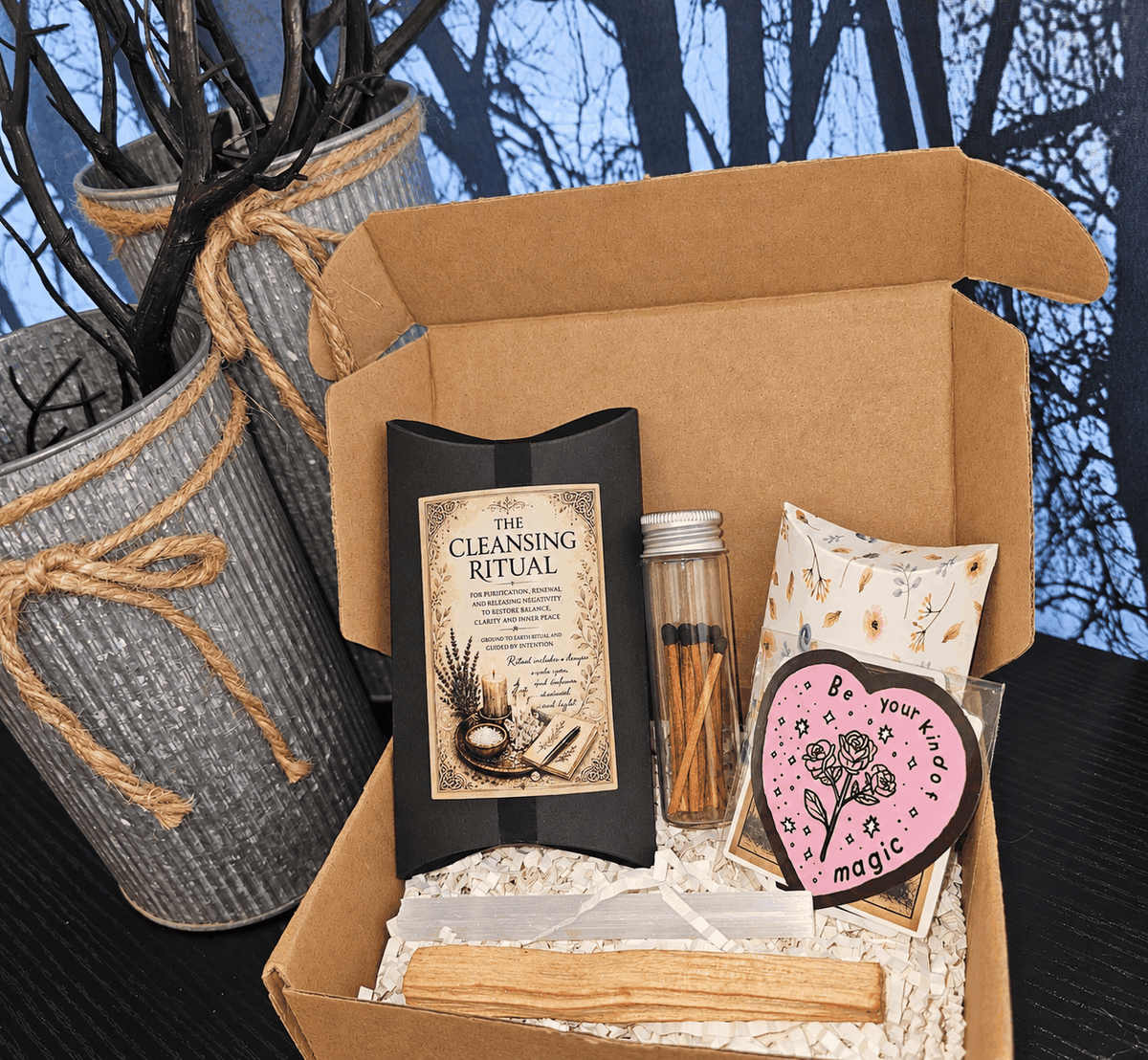 The Cottage Collections gift box with a black cleansing ritual pouch, glass jar, floral sachet and pink heart card