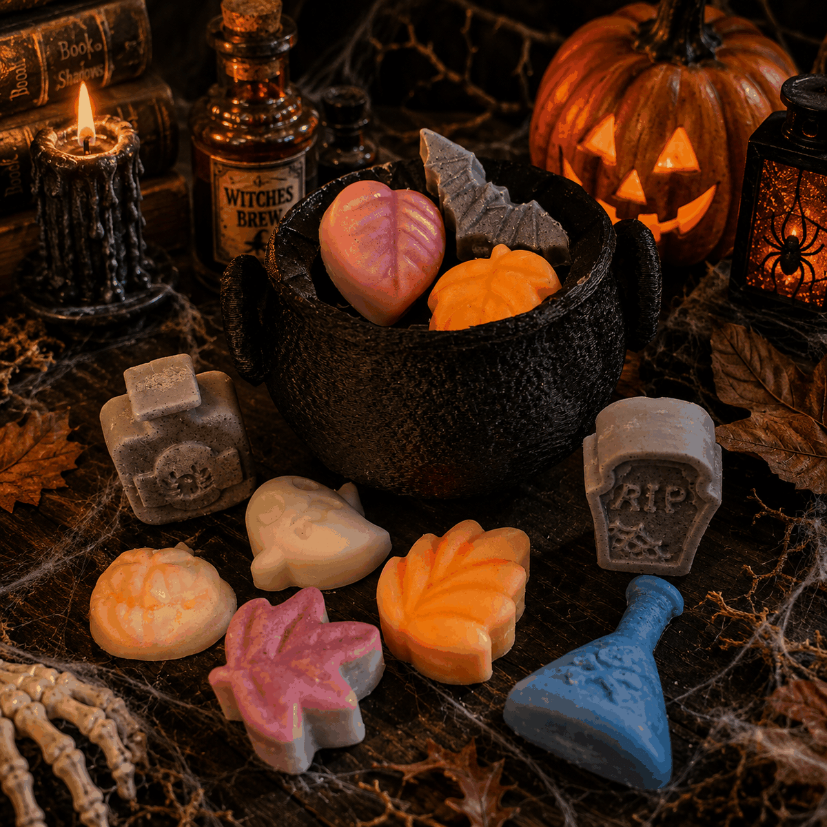 Graveyard Brew Wax Melts in a black cauldron with colorful Halloween-shaped wax pieces, including ghosts, tombstones, leaves and potion bottles