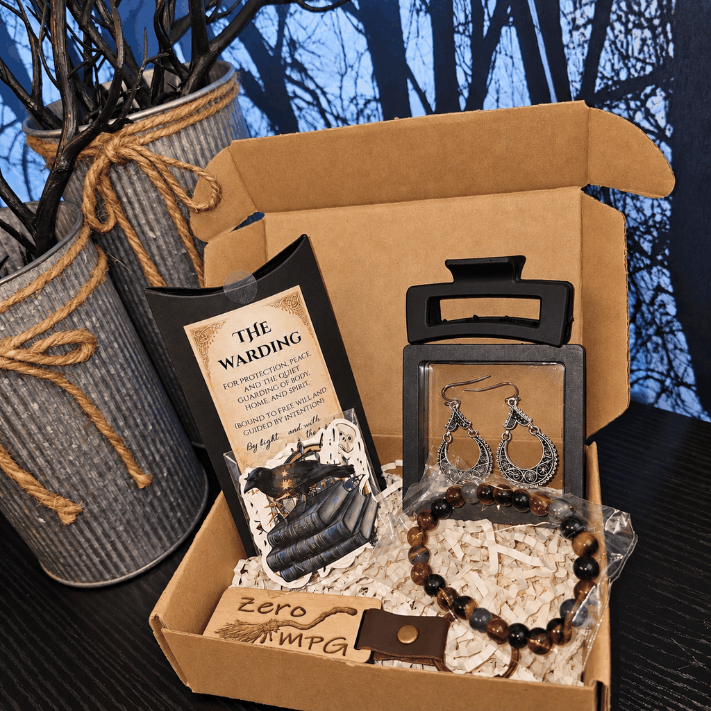 Raynes Cauldron Mini ritual box with kraft packaging, a black ritual card, crystal bead bracelet and silver earrings