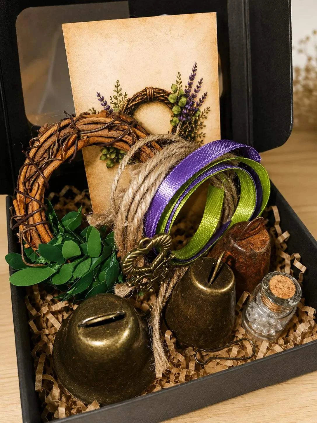 Threshiold Bells set with bronze bells, a twig wreath, natural rope, purple and green ribbons, key and quartz vial