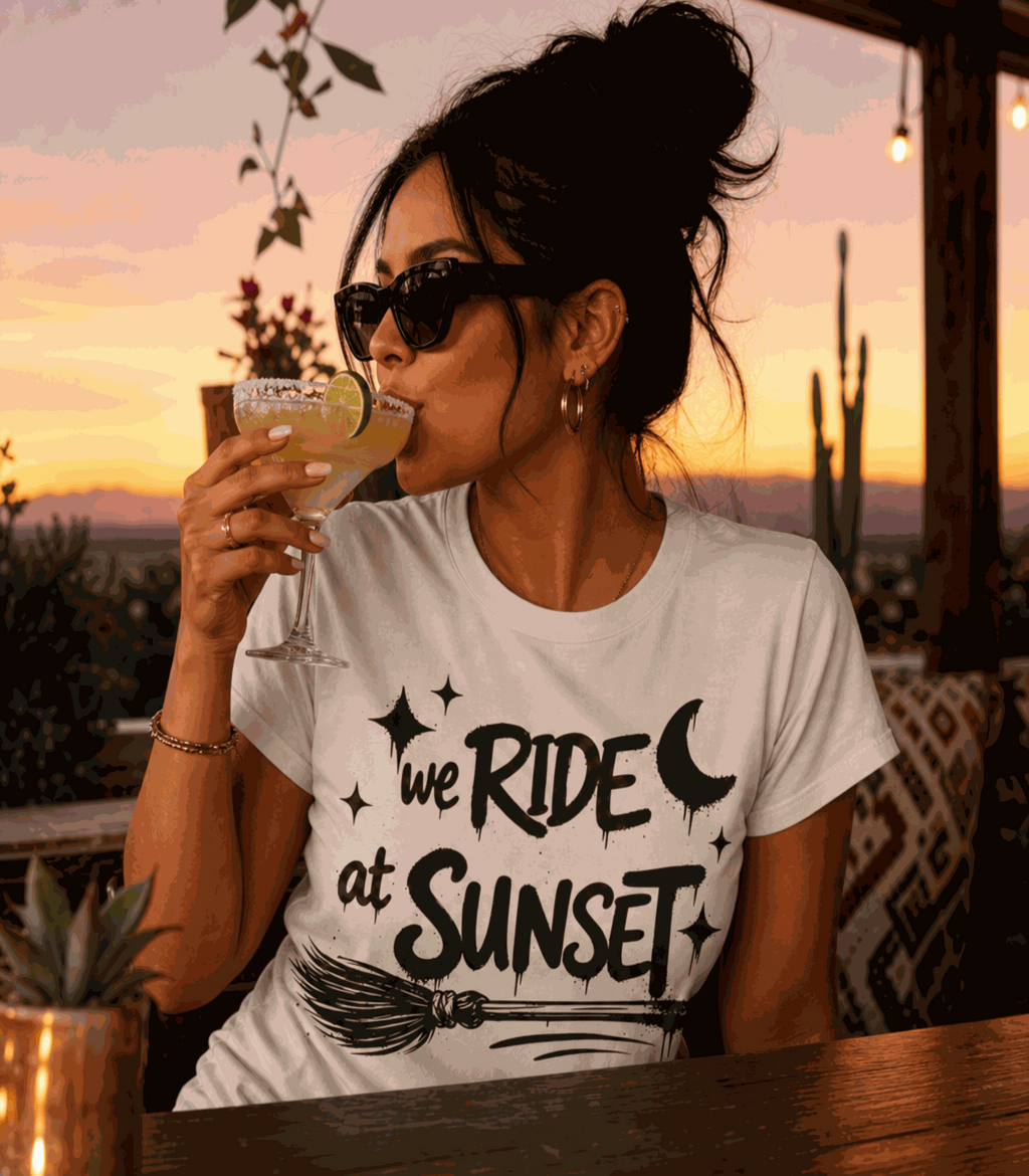 We Ride at Sunset T-shirt, Natural tee modeled at sunset with moon, stars and broom graphic